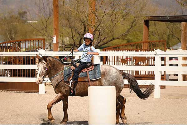 Girl riding horse