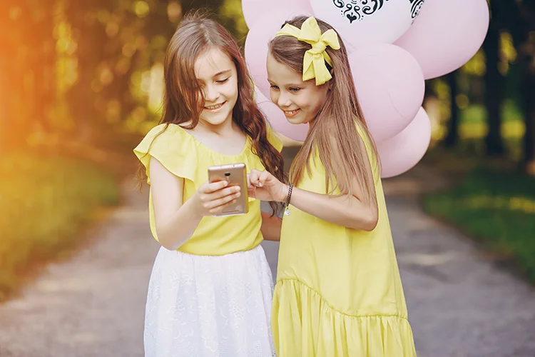 Young Girls with Balloons at Birthday Party